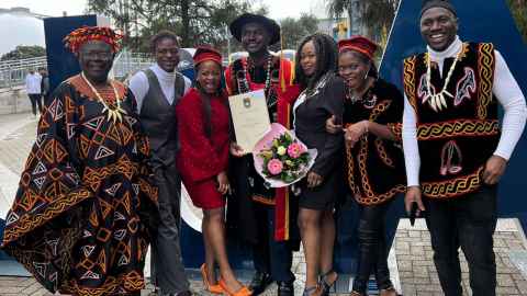 Bernard Sama and his proud family, which includes his partner, three daughters, father and brother.