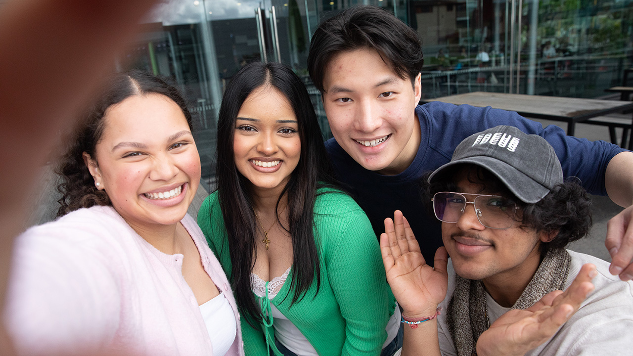 Group of happy students taking a selfie.