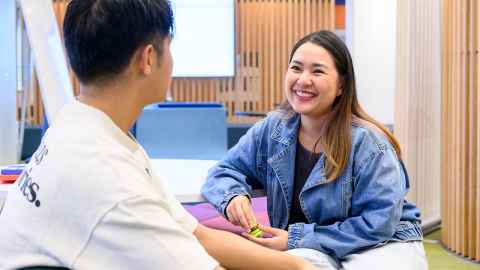 Students happily talking to each other.