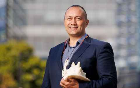 Michael Steedman holding a conch shell