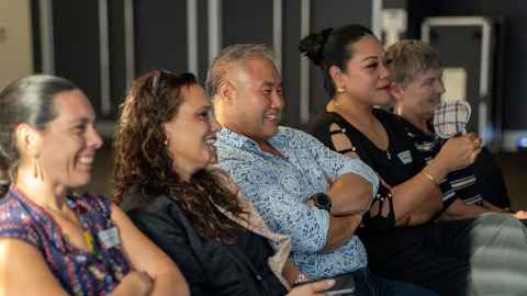 Alumni, staff and researchers celebrating at the Auckland Business School
