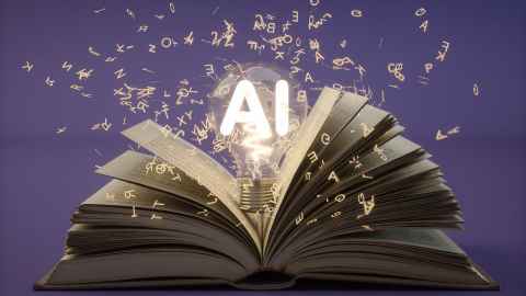 A book with a lightbulb above it with the letters AI lit up, the image is surrounded by golden alphabet letters