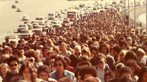 The tail of the 1975 Māori Land March crossing the Auckland Harbour Bridge.
