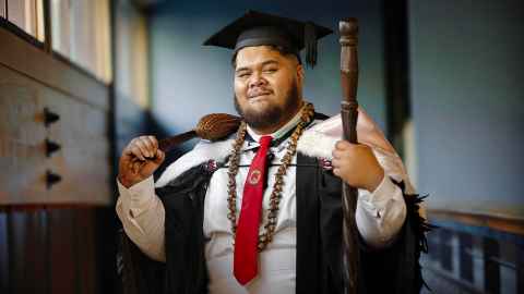 aliaoa Aidan Samasoni-Tukuitonga inside the Auckland Law Library.