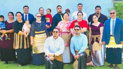 Doctoral candidate Dougie Atiola with his family