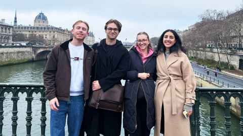 Samuel Foote, Benjamin Jones, Chloe Mills and Jumana Maash on a bridge over the River Seinne in Paris