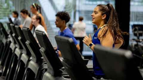 Students running on treadmills.