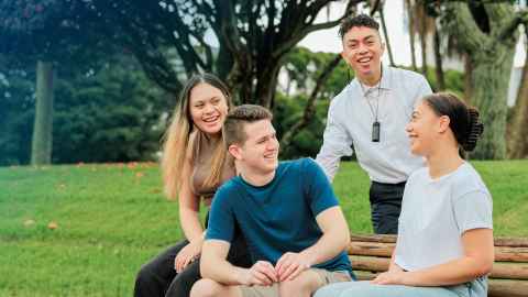 Students sitting together outside
