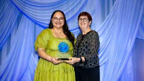 Chancellor Cecilia Tarrant presenting an awards to a student