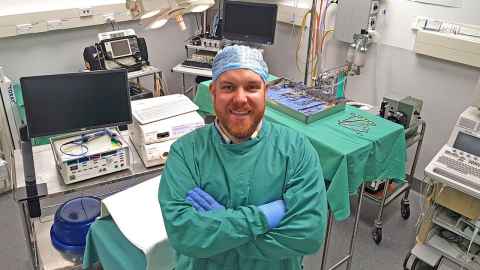 Dr Tim Angeli in surgical scrubs
