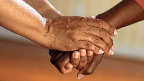 Hands holding each other 