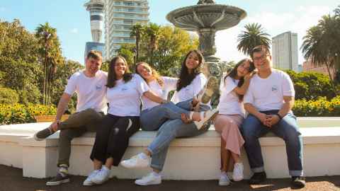 Students sitting on the fountain in Albert Park
