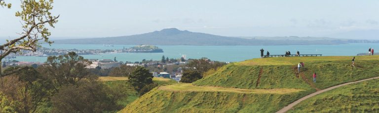 Mount Eden in the foreground, Rangitoto in the background across the harbour.