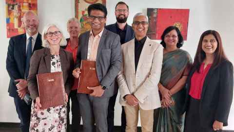 Group including Dawn Freshwater and Dr Sekar Viswanathan posing after signing of an MoU
