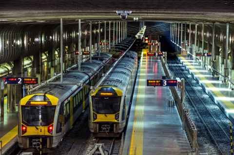 Two trains alongside platforms at Britomart station