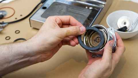 A small component being repaired