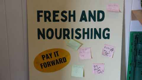 Students in the window of a campus cafe.