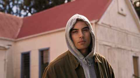 A young man in a hoodie.