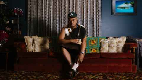 John-Paul Foliaki sitting on a sofa