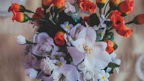 A bouquet of orange and white flowers.