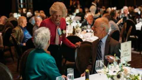 Socialising at a Golden Graduates event.