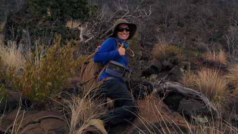 Sophie Miller with her outdoor gear doing research in the bush