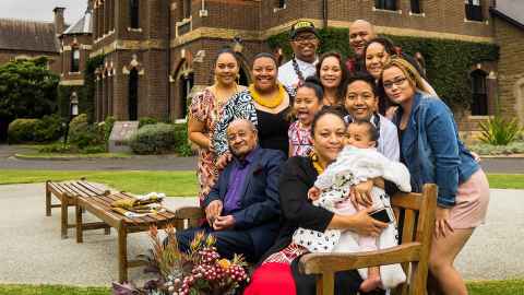 Tammy (standing second from left) outside Trinity College in Melbourne with her family at the welcome event for her new role.