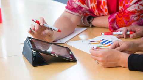 Hands with tablet