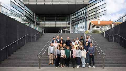 A group of people on the steps of the Sir Owen G Glenn Building.