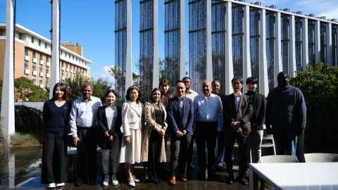 A group of people standing outside a building in Melbourne