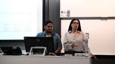 Two students making a presentation in a classroom