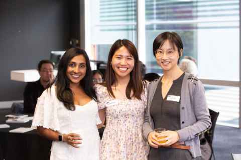 Three smiling young women.