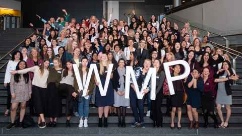 Group photo of Women's Mentoring Programme participants holding large letters W M P