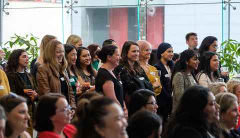 Image of several women standing at an event.