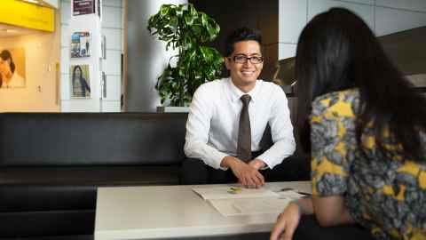 student in professional attire talking