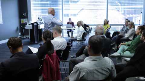 Group of people sitting in a room