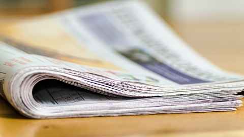 A newspaper on a table