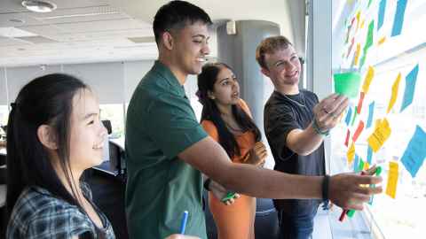 Undergrad students at table