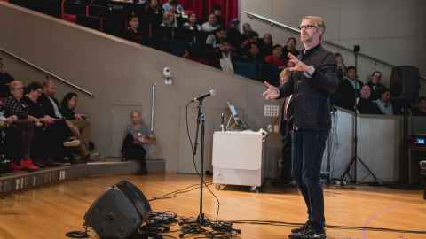 Senior Lecturer in Popular Music Godfrey de Grut speaks to people in a full lecture theatre