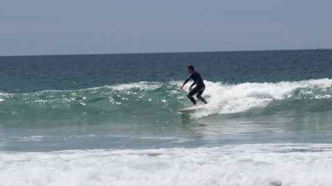 Daniel Cowley surfing