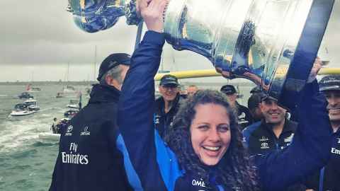 Elise Beavis holding the America's Cup trophy