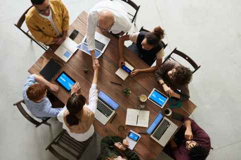 birds eye view of people talking at table