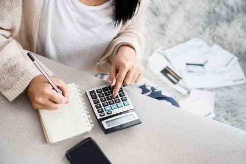 woman using calculator