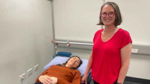 Two Neurogenetics Research Clinic staff in an assessment room