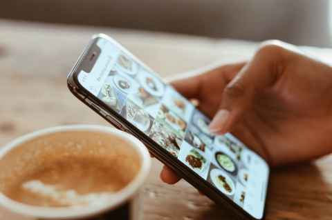 Hand scrolling on Instagram
