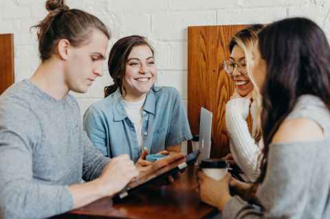 Students with coffee smiling