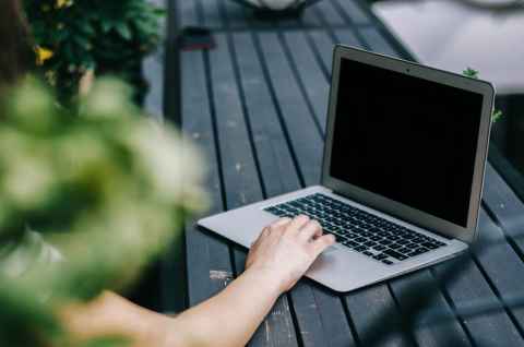 Hand on a laptop