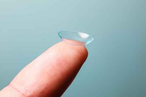 contact lens fluid dropping into container