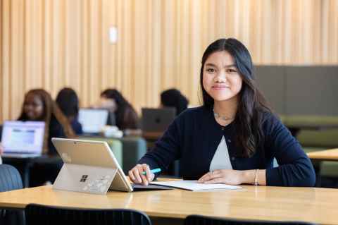 Woman at desk with laptop