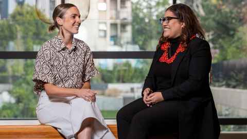 two woman smiling